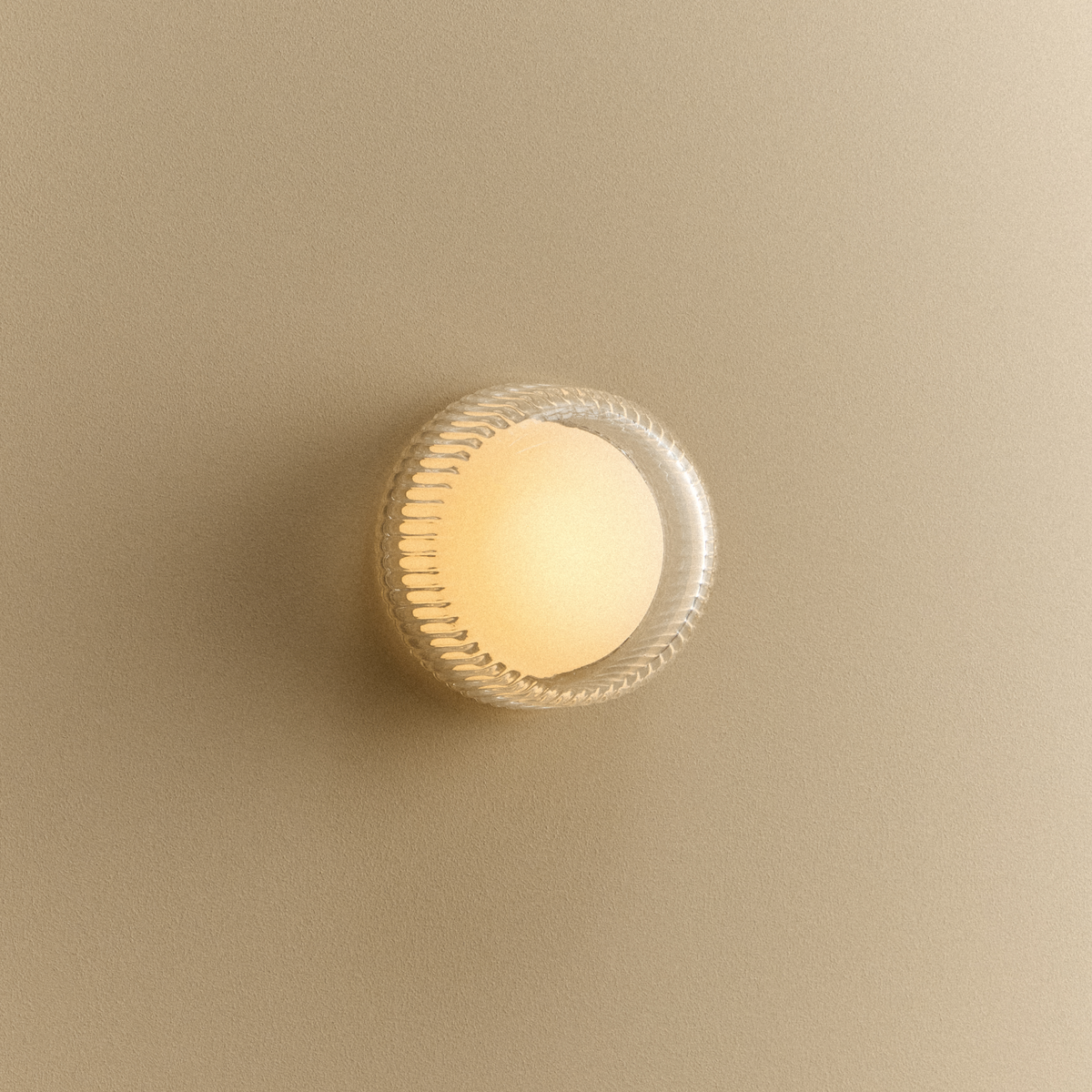Firth Wall Light switched on, casting a warm glow