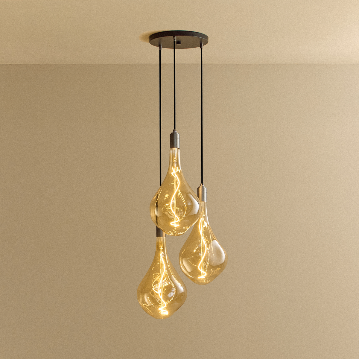 Graphite Triple Pendant with Voronoi bulbs, lit warm